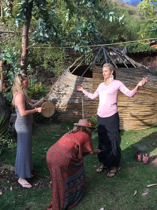 Leslie L Harrington during cleansing ceremony with two other women