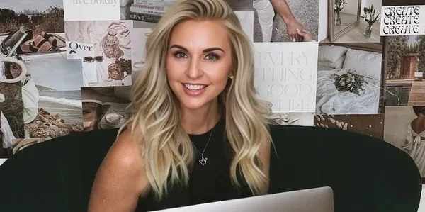 Leslie L. Harrington at her desk smiling