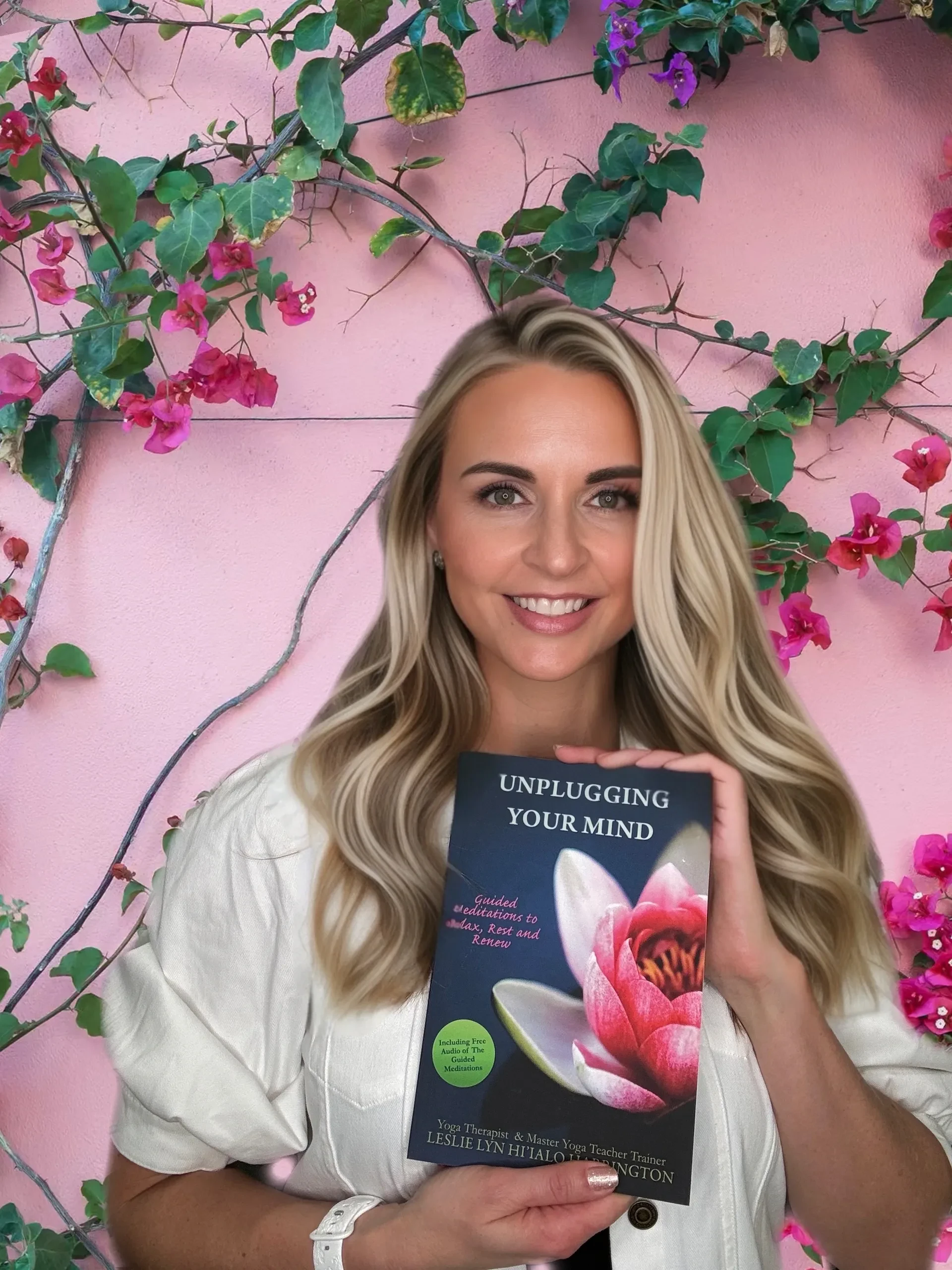 Coach Leslie L. Harrington holding her book Unplugging Your Mind
